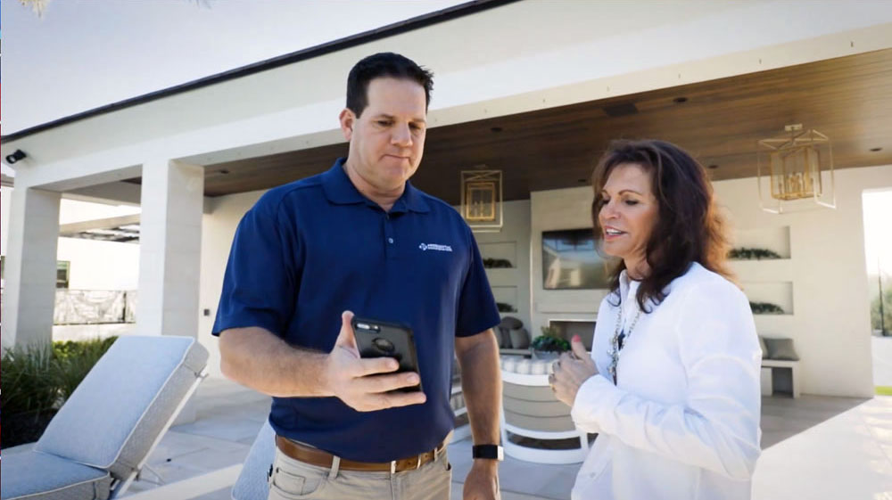Presidential Pools project manager with customer during pool construction